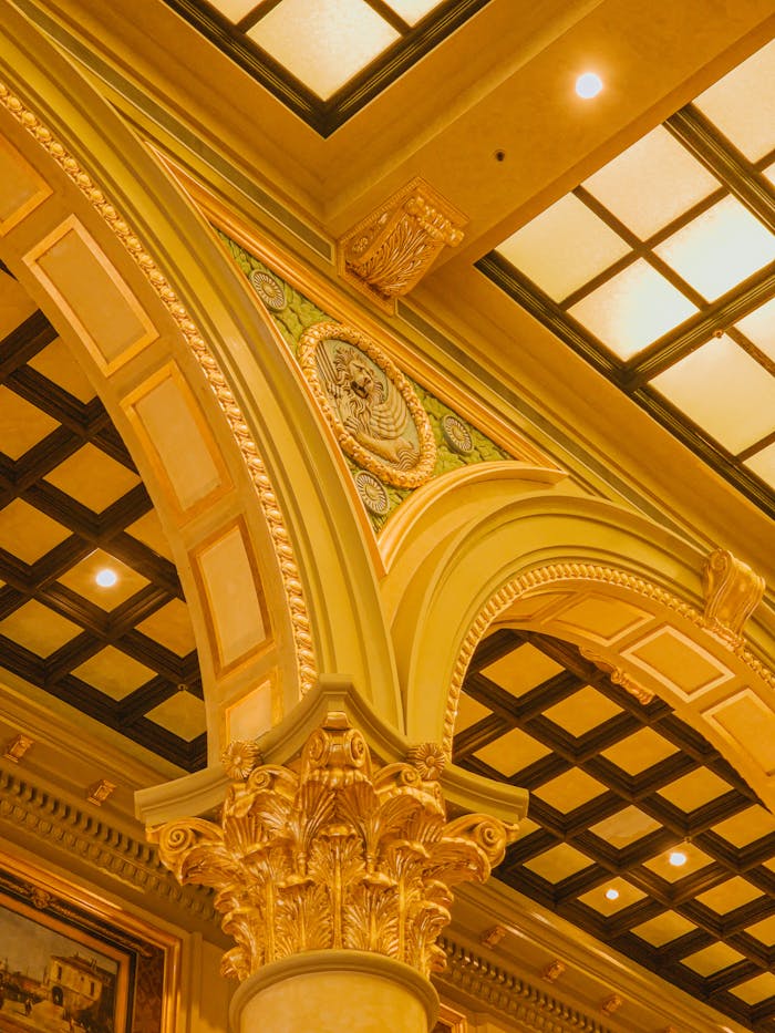Intricate architectural elements of a casino ceiling in Macao capture a luxurious ambiance.